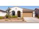 Single-story home with two-car garage and desert landscaping at 19922 W Exeter Blvd, Litchfield Park, AZ 85340