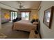 Comfortable bedroom with a queen-size bed and patio access at 3927 N Indiana Ave, Florence, AZ 85132