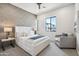 Secondary bedroom with a queen-size bed and seating area at 377 E Windsor Ave # 21, Phoenix, AZ 85004