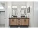 Double vanity bathroom with modern wood cabinets and gray countertops at 377 E Windsor Ave # 21, Phoenix, AZ 85004