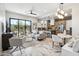 Open living area showcasing a modern kitchen, island, and comfortable seating near sliding glass doors at 377 E Windsor Ave # 21, Phoenix, AZ 85004