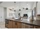 Contemporary kitchen island with dark countertops and stainless steel appliances at 377 E Windsor Ave # 21, Phoenix, AZ 85004