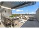 Relaxing rooftop deck with pergola, seating, and dining area at 377 E Windsor Ave # 21, Phoenix, AZ 85004