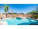 Inviting kidney-shaped pool with a stone waterfall feature at 29031 N 69Th Dr, Peoria, AZ 85383