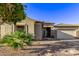 One-story home with desert landscaping, stone accents, and a two-car garage at 13506 W Earll Dr, Avondale, AZ 85392