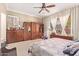 Spacious bedroom with a king-size bed and built-in wooden storage at 13506 W Earll Dr, Avondale, AZ 85392
