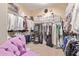 Large walk-in closet with ample shelving and hanging space at 13506 W Earll Dr, Avondale, AZ 85392