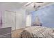 Light and airy bedroom with a decorative bed and large closet at 13506 W Earll Dr, Avondale, AZ 85392