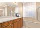 Bathroom with double vanity, soaking tub, and shower at 13506 W Earll Dr, Avondale, AZ 85392