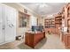 Home office with built-in shelving and large desk at 13506 W Earll Dr, Avondale, AZ 85392
