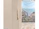 Hallway with a mountain mural, niche, and tiled floor at 13506 W Earll Dr, Avondale, AZ 85392