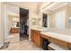 Main bathroom features double sinks, walk-in closet, and bathtub at 13506 W Earll Dr, Avondale, AZ 85392
