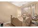 Elegant bedroom featuring a large bed and ornate headboard at 13506 W Earll Dr, Avondale, AZ 85392