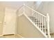 Elegant staircase with white railings leading to the upper level at 15685 W Mackenzie Dr, Goodyear, AZ 85395