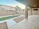 Covered patio, artificial turf, and gravel backyard at 15685 W Mackenzie Dr, Goodyear, AZ 85395