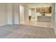 Open concept living room with kitchen view at 15685 W Mackenzie Dr, Goodyear, AZ 85395