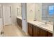 Primary bathroom boasts dual sinks, a large vanity, and a soaking tub at 15685 W Mackenzie Dr, Goodyear, AZ 85395