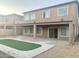 Two-story house with covered patio and artificial turf at 15685 W Mackenzie Dr, Goodyear, AZ 85395