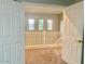 Upstairs loft area with a view to the lower level at 15685 W Mackenzie Dr, Goodyear, AZ 85395