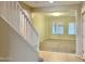 Spacious living room with neutral carpeting and natural light at 15685 W Mackenzie Dr, Goodyear, AZ 85395