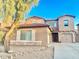 Two-story house with a large front yard and driveway at 15685 W Mackenzie Dr, Goodyear, AZ 85395