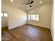 Bright bedroom with hardwood floors and large window at 15038 E Greene Valley Dr, Fountain Hills, AZ 85268