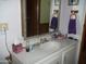 Bathroom with vanity, sink, and mirror at 201 S Greenfield Rd # 197, Mesa, AZ 85206