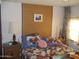 Cozy bedroom with patchwork quilt and nightstands at 201 S Greenfield Rd # 197, Mesa, AZ 85206