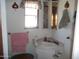 Small bathroom with corner sink and shower at 201 S Greenfield Rd # 197, Mesa, AZ 85206