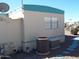 Side view of mobile home with AC unit at 201 S Greenfield Rd # 197, Mesa, AZ 85206