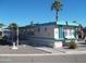 Mobile home with carport, steps and mature landscaping at 201 S Greenfield Rd # 197, Mesa, AZ 85206