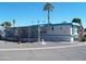 Mobile home with covered porch and desert landscaping at 201 S Greenfield Rd # 197, Mesa, AZ 85206