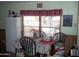 Small dining area with table and chairs at 201 S Greenfield Rd # 197, Mesa, AZ 85206