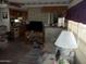 Living room with kitchen views and stone accent wall at 201 S Greenfield Rd # 197, Mesa, AZ 85206