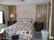Main bedroom featuring a comfortable bed and ample closet space at 201 S Greenfield Rd # 197, Mesa, AZ 85206