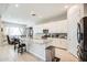 Modern kitchen with granite countertops and white cabinets at 21551 E Waverly Ct, Queen Creek, AZ 85142