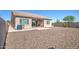 House exterior and backyard with gravel and patio at 21551 E Waverly Ct, Queen Creek, AZ 85142