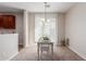 Bright dining area with a white table and a chandelier at 40375 W Helen Ct, Maricopa, AZ 85138