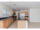 Spacious kitchen with an island, stainless steel appliances, and light wood cabinets at 8834 S 12Th St, Phoenix, AZ 85042