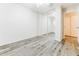 Light and airy bedroom with mirrored closet doors and wood-look floors at 2783 E Mineral Park Rd, San Tan Valley, AZ 85143