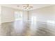 Bright living room featuring hardwood floors and sliding glass door access to backyard at 2783 E Mineral Park Rd, San Tan Valley, AZ 85143