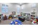 Playroom features a sitting area and plenty of toy storage at 10304 W Pinnacle Vista Dr, Peoria, AZ 85383