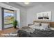 Virtually staged main bedroom with mountain views and a comfortable bed at 7121 E Rancho Vista Dr # 4004, Scottsdale, AZ 85251
