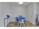 Small dining area with round table and blue tablecloth at 7121 E Rancho Vista Dr # 4004, Scottsdale, AZ 85251