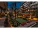Evening view of a lush courtyard with putting green at 7121 E Rancho Vista Dr # 4004, Scottsdale, AZ 85251