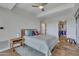 Bedroom with wood floors, ceiling fan, and walk-in closet at 7121 E Rancho Vista Dr # 4004, Scottsdale, AZ 85251