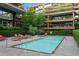 Outdoor pool with lounge chairs and lush landscaping at 7121 E Rancho Vista Dr # 4004, Scottsdale, AZ 85251