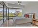 Bedroom with wood floors, mountain view, and ceiling fan at 7121 E Rancho Vista Dr # 4004, Scottsdale, AZ 85251