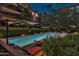 Evening view of a resort-style pool and spa at 7121 E Rancho Vista Dr # 4004, Scottsdale, AZ 85251