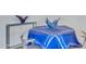 Close-up of a round dining table with blue tablecloth at 7121 E Rancho Vista Dr # 4004, Scottsdale, AZ 85251